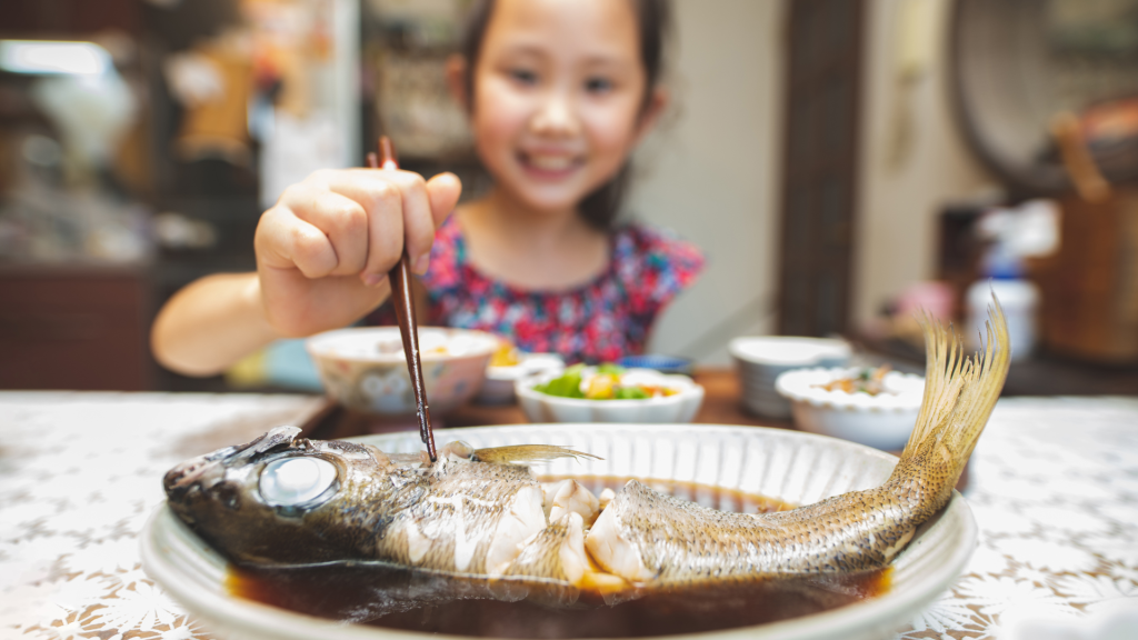 Kids Eating Fish Meal